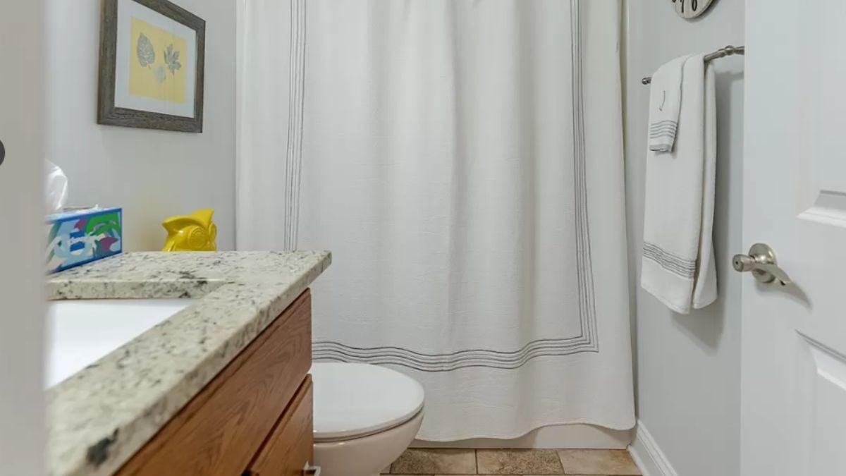 Simple Bathroom with Granite Countertop and Thoughtful Details