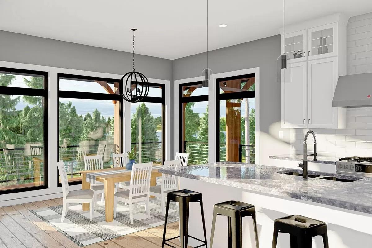Large Windows Light Up This Open Kitchen and Dining Space