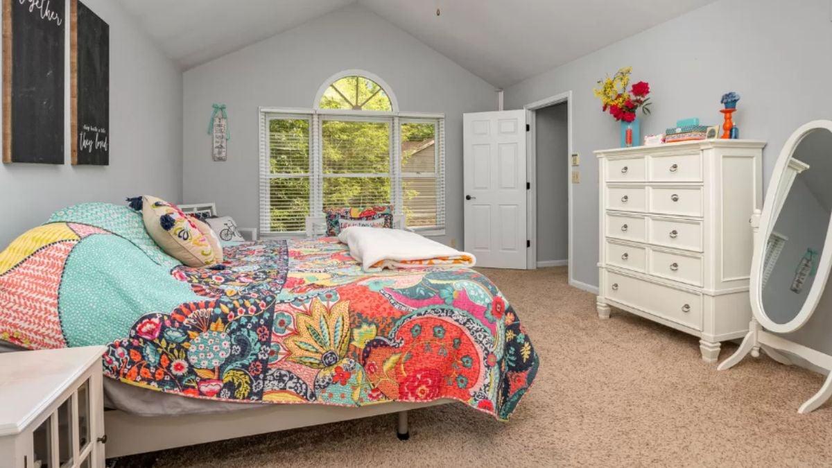 Vibrant Quilt Adds a Splash of Color to This Serene Bedroom