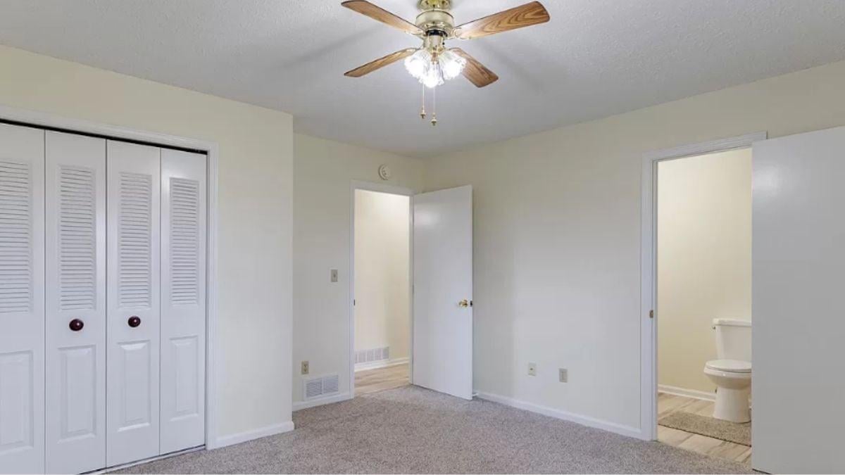 Bright Room with Functional Ceiling Fan and Access to En Suite