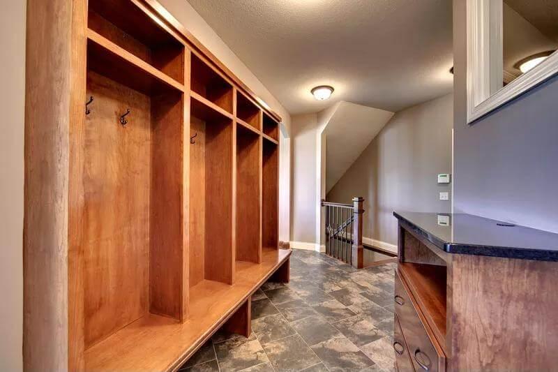 Discover the Wall-Length Mudroom Storage with Slate Flooring