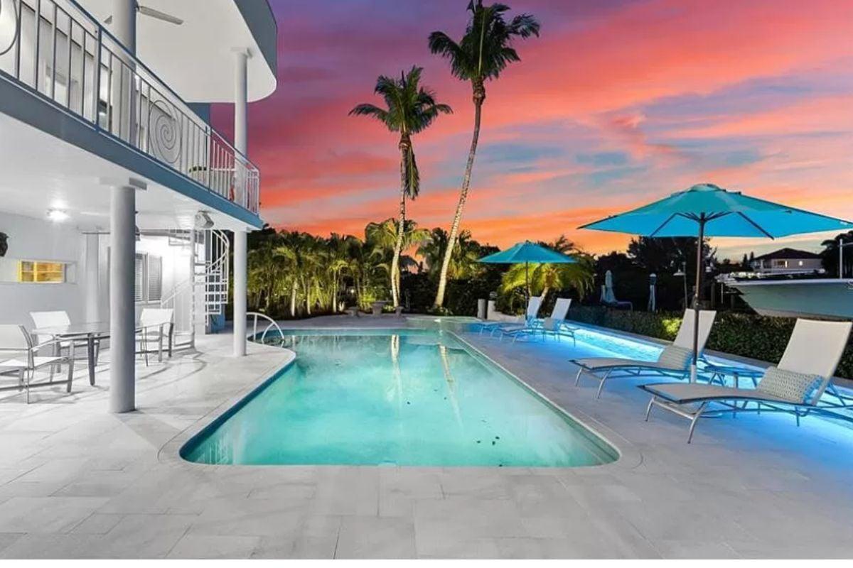 Unwind at This Poolside Oasis with Vibrant Sunset Views