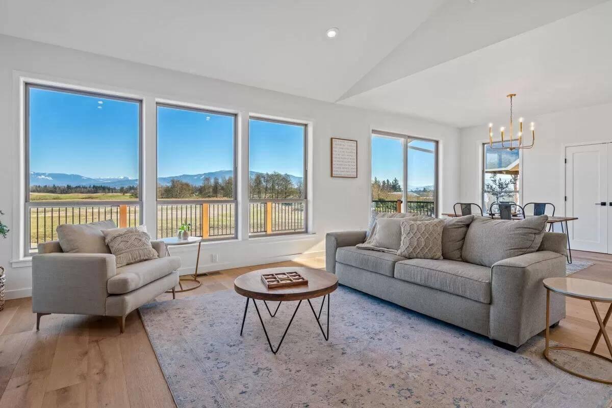 Expansive Windows with Mountain Views in This Craftsman Living Space