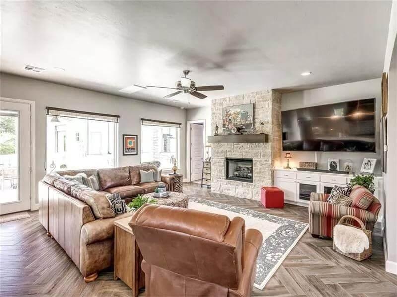 Family Room Focused on a Cozy Stone Fireplace, With Smart TV Placement