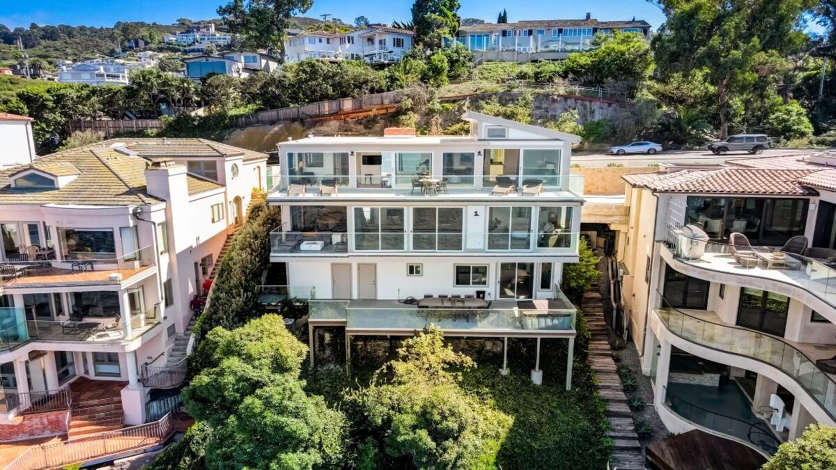 Stunning Multi-Story Home with Expansive Glass Balconies