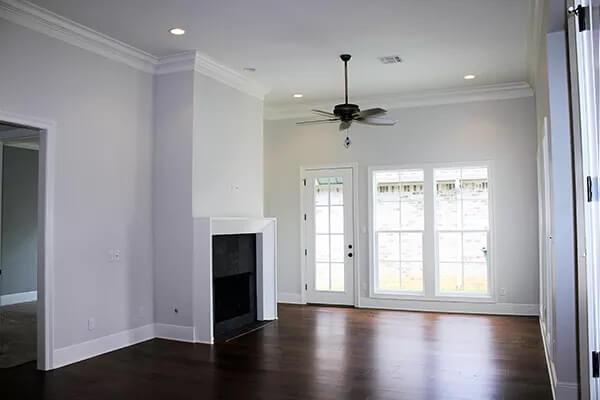 Elegant Living Area Featuring a Modern Fireplace and French Doors