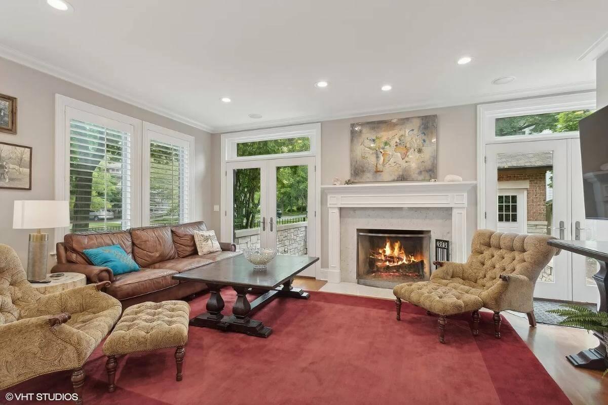Cozy Living Room with a Classic Fireplace and Plush Seating