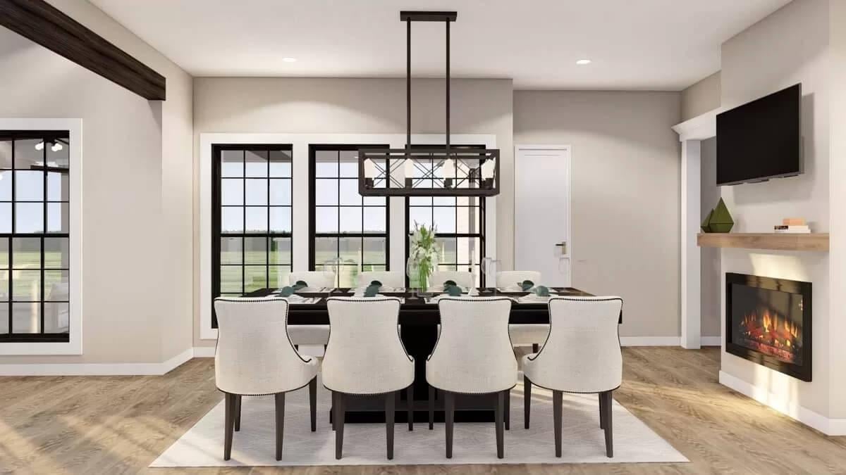 Dining Room with Statement Lighting and Fireplace Warmth