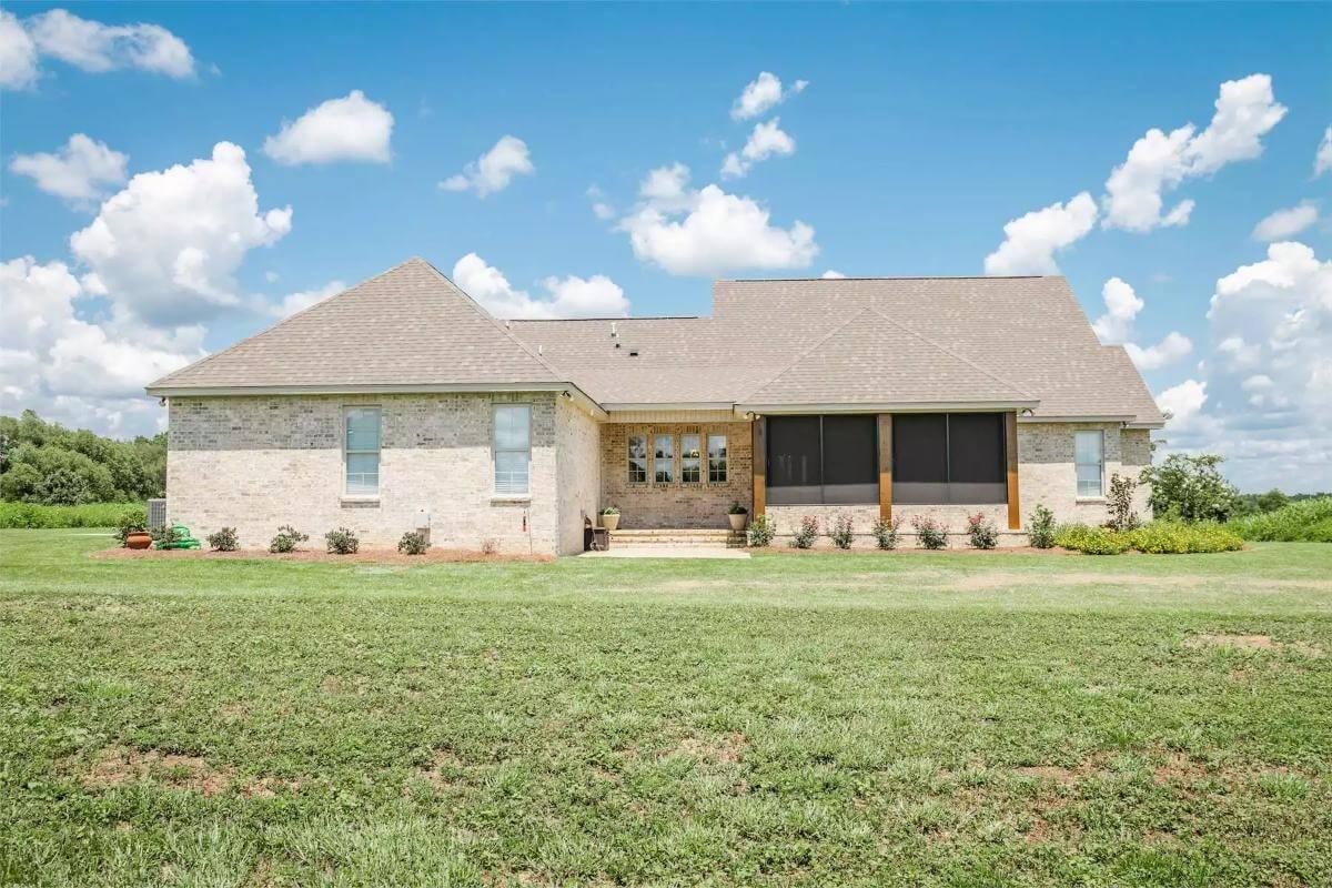 Notice the Spacious Screened Porch on This Brick Beauty