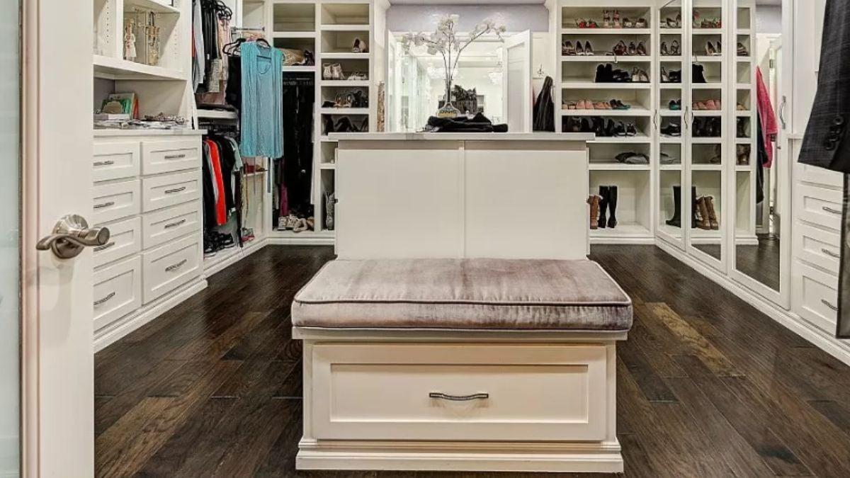 Luxurious Walk-In Closet with Plush Seating at the Center