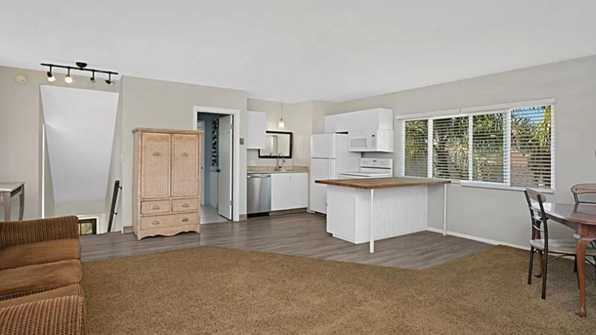 Look at This Bright Living Space with a Handy Breakfast Bar