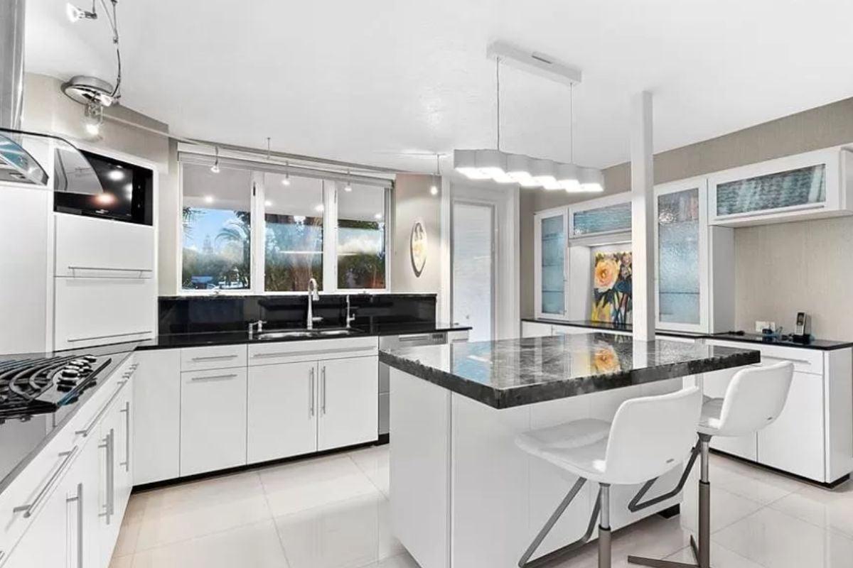 Modern Kitchen with Sleek Countertops and Unique Lighting