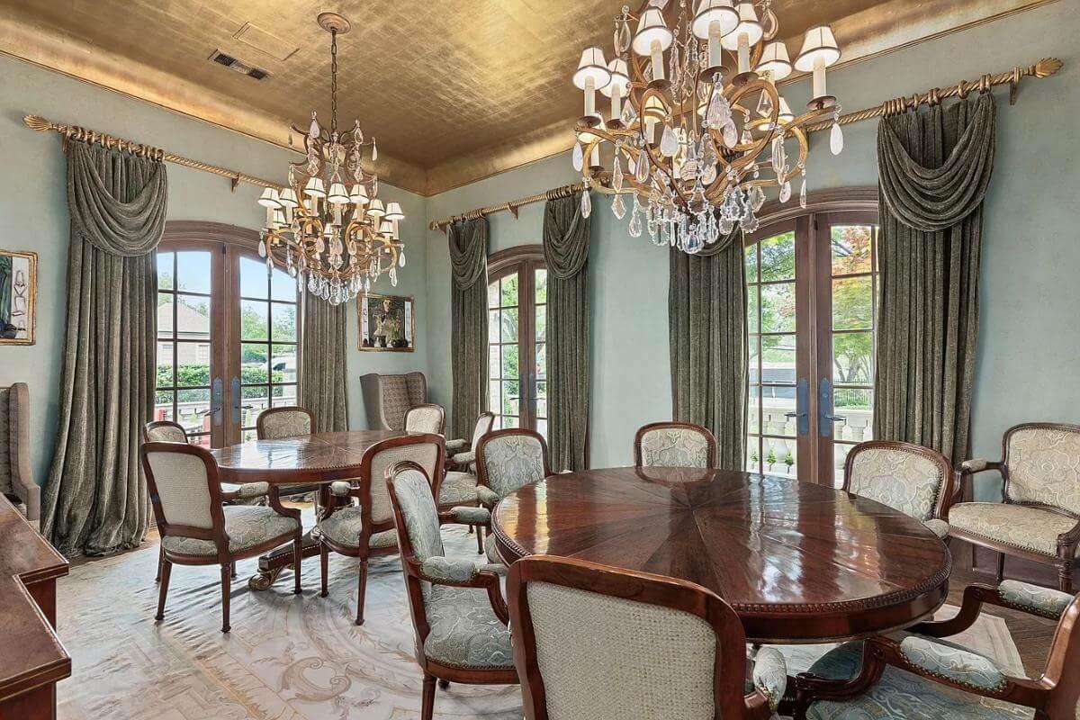 Luxurious Dining Room with Gilded Ceiling and Chandeliers That Make a Statement