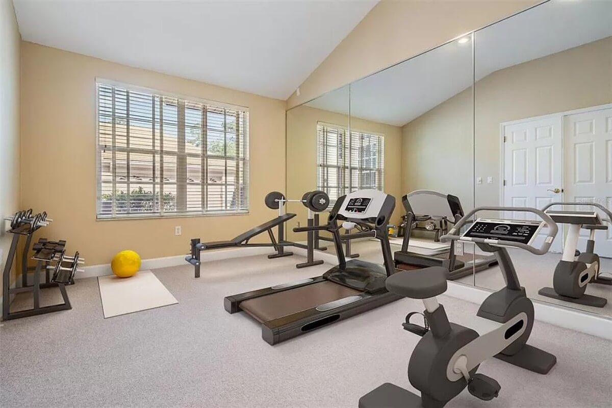 Notice the Wall-to-Wall Mirrors in This Home Gym