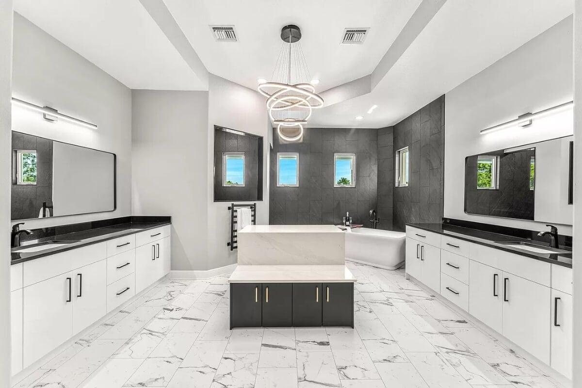 Notice the Striking Modern Light Fixture in This Elegant Bathroom