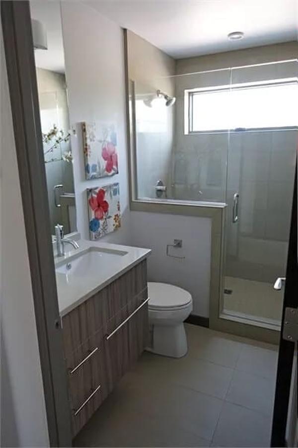 Compact Bathroom Design with Frameless Glass Shower