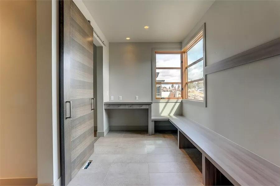 Sleek Mudroom Highlighting Sliding Door and Practical Bench Seating