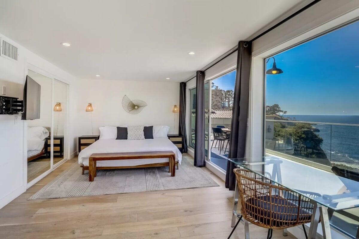 Oceanfront Bedroom with Stunning Views and a Chic Glass Desk