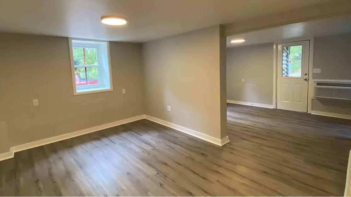 Versatile Craftsman Basement with Natural Lighting and Laminate Floors