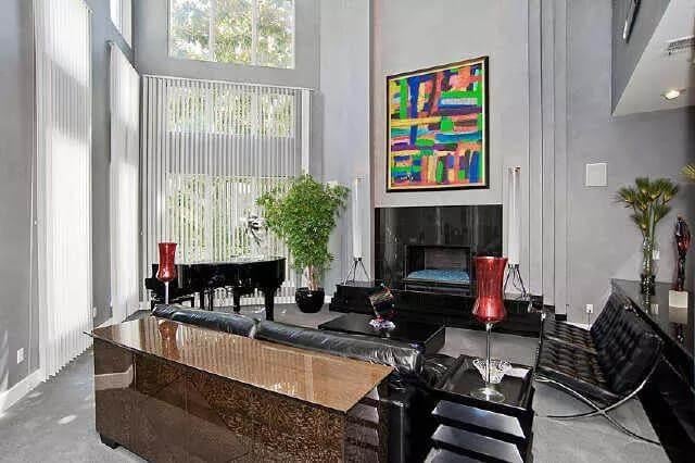 Modern Living Room with Striking High Ceilings and a Grand Piano