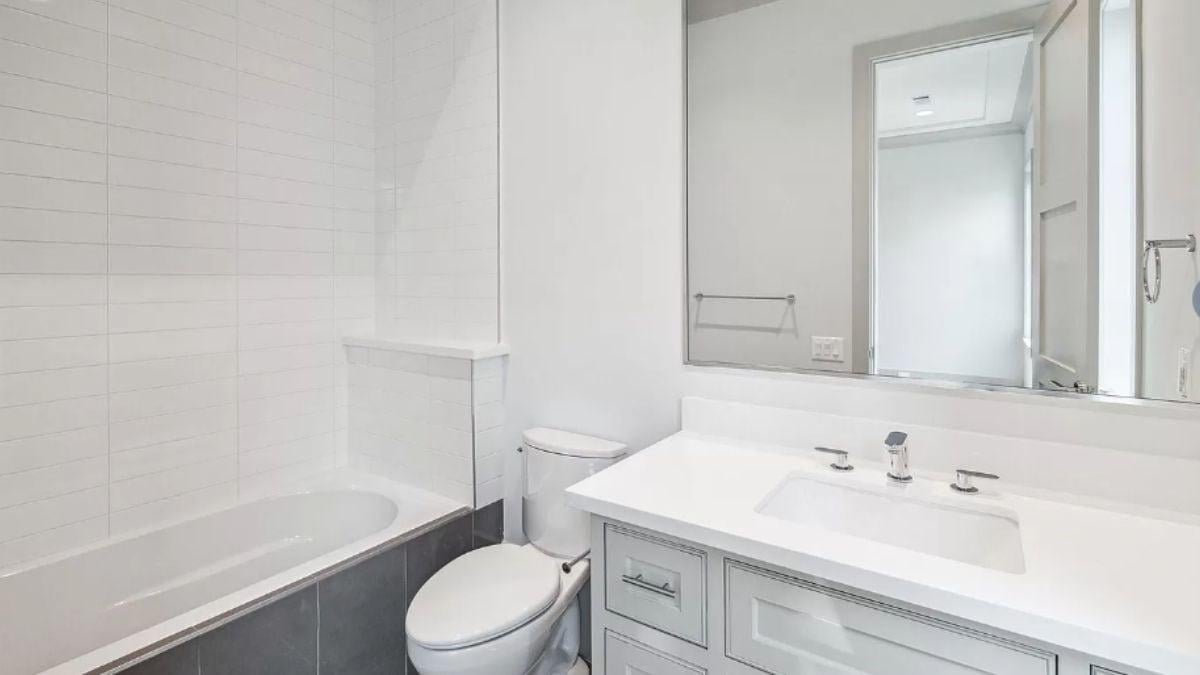 Spot the Sleek Vanity and Subtle Tile Details in This Clean Bathroom