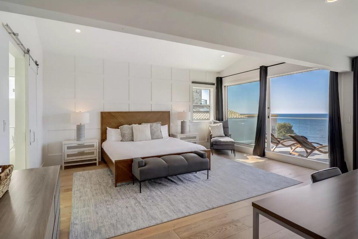 Oceanview Bedroom with Modern Paneling and a Private Balcony