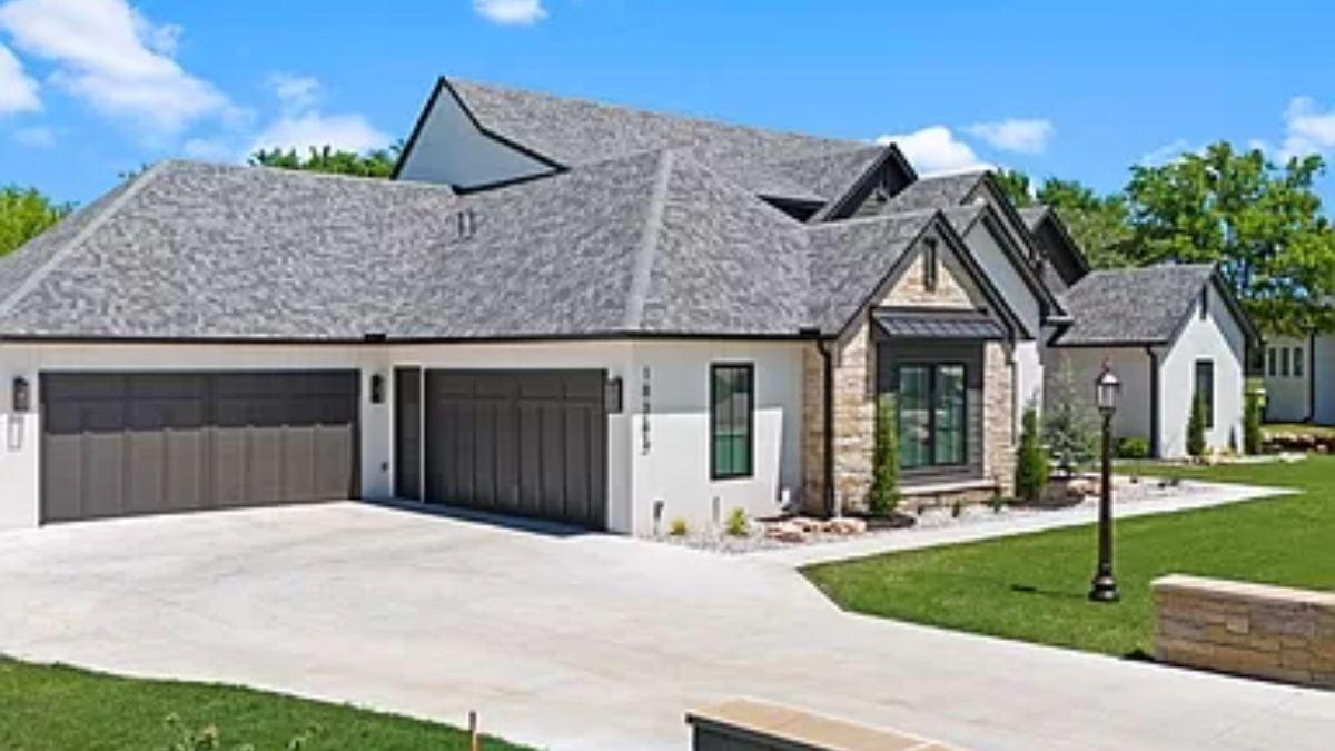 Balanced Blend of Stone and Siding with a Triple Garage โ Impressive Roofline