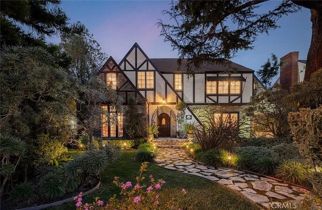 Tudor Elegance Illuminated at Twilight with Enchanting Stone Path