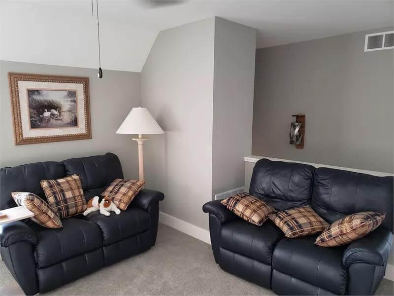 Cozy Corner with Plaid Accents and Comfy Recliners