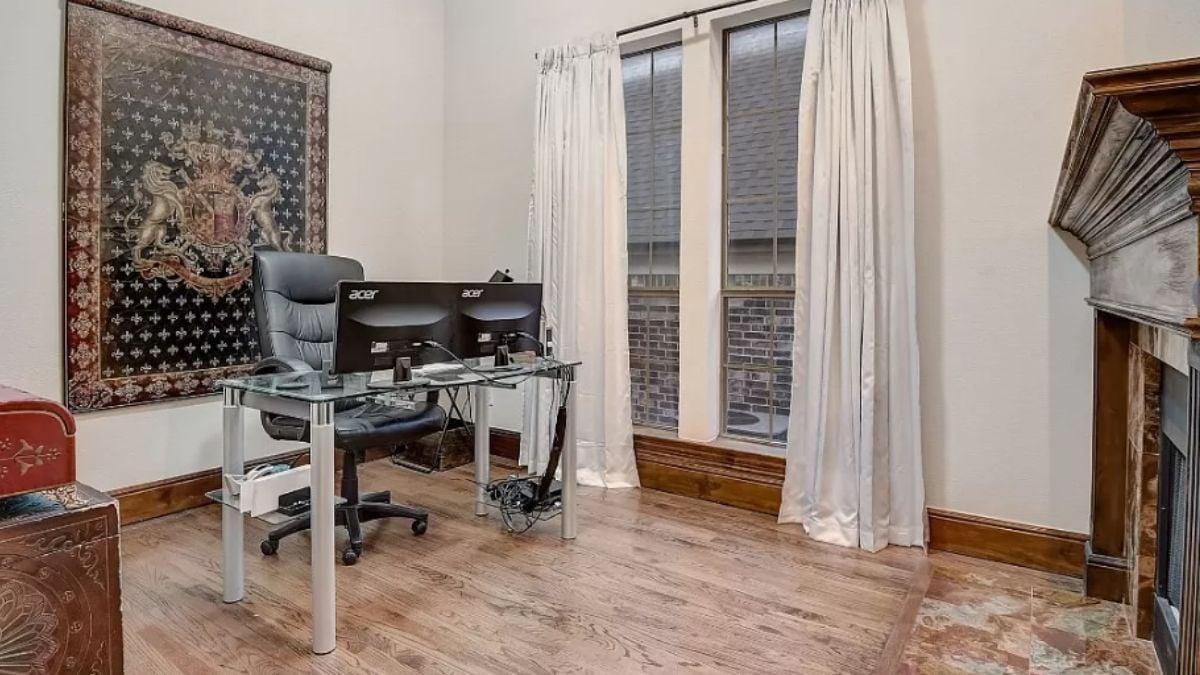 Check Out the Traditional Fireplace in This Home Office