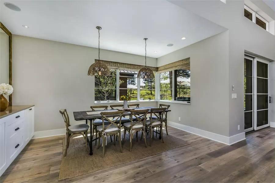Spacious Dining Room with a Rustic Chandelier