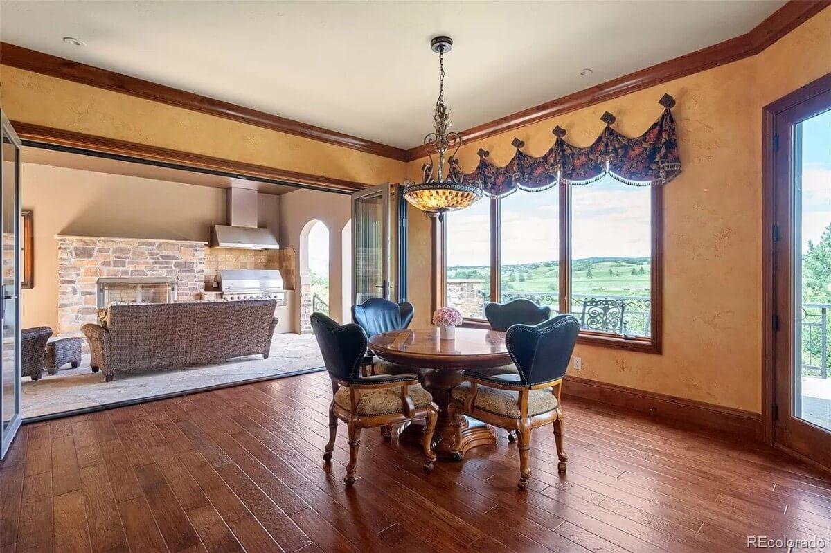 Eclectic Dining Space with Stunning Views and a Rustic Grill Setup