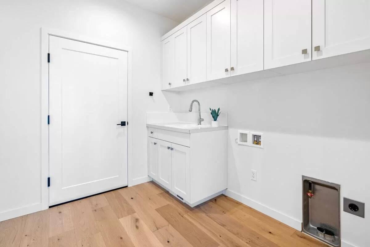 Spot the Practical Built-in Laundry Sink in This Utility Space