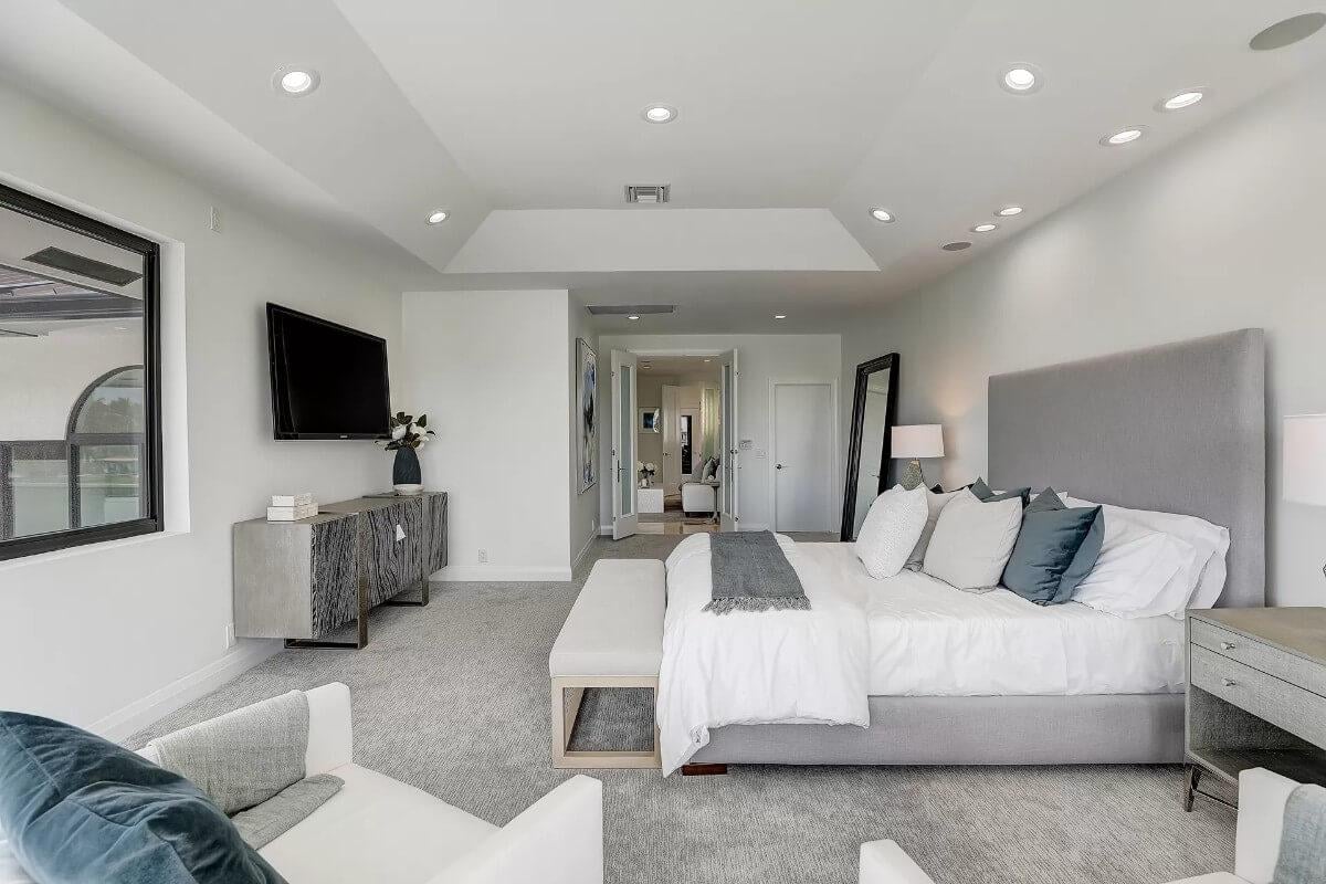 Take a Look at This Spacious Master Suite with Soft Gray Tones and Modern Accents