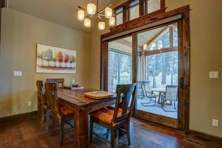 Charming Dining Space with a View and Wooden Detailing