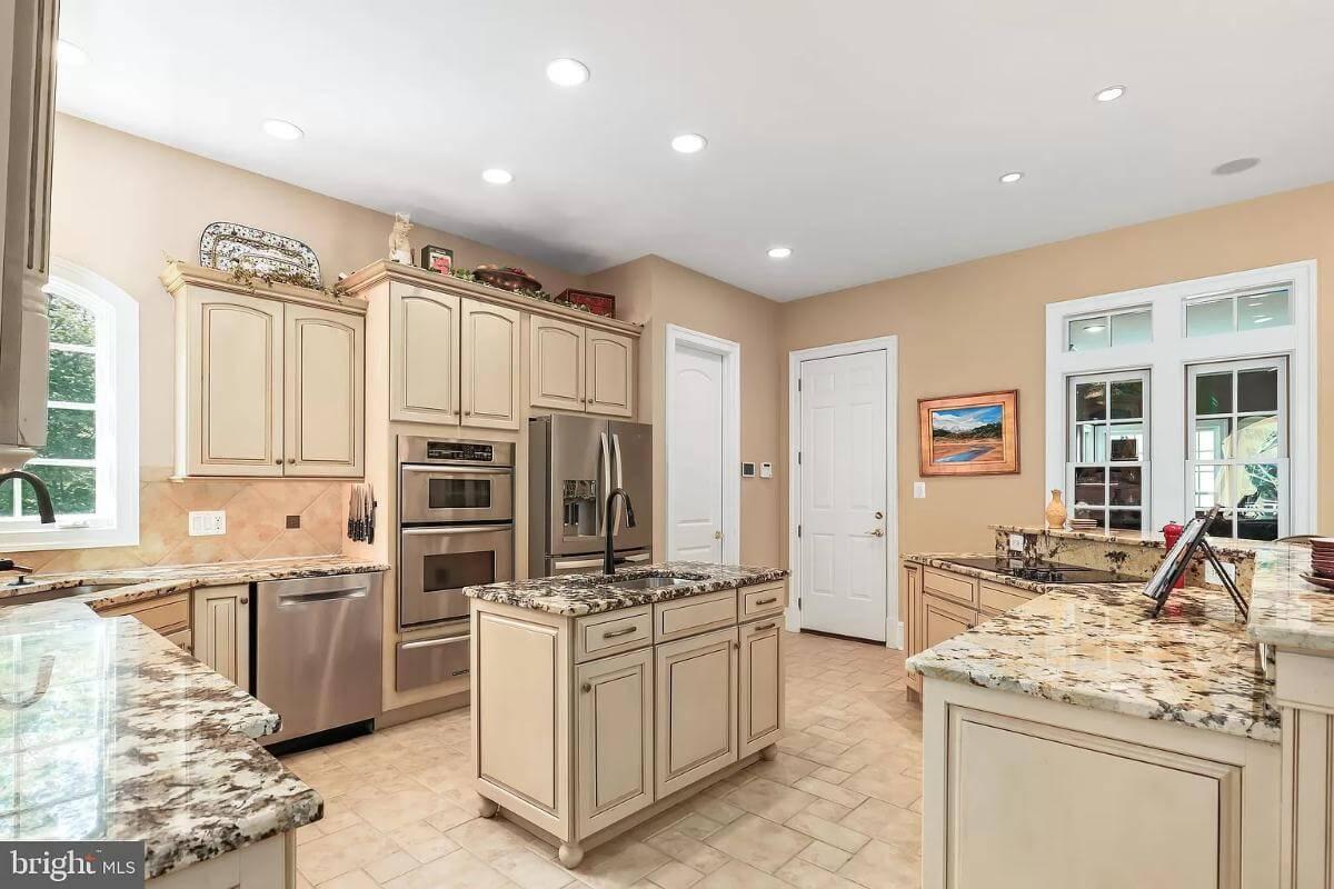Traditional Kitchen with Granite Countertops and a Compact Island