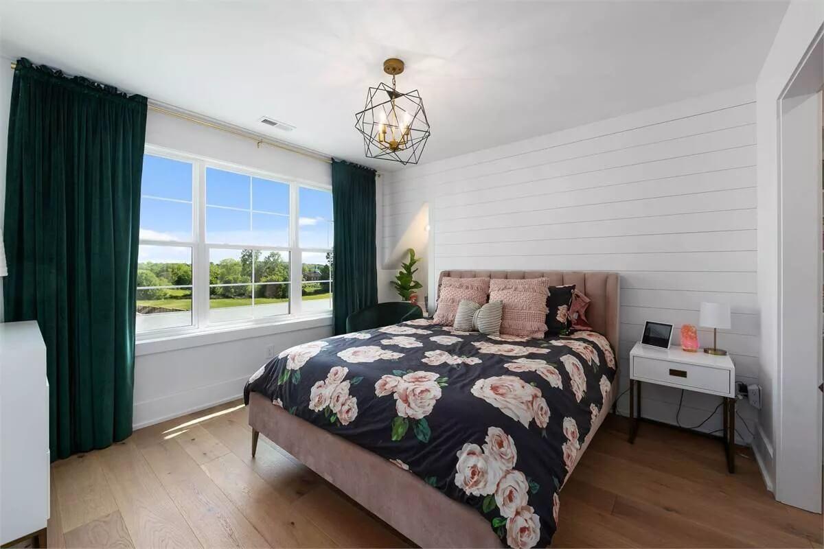 Admire the Bold Floral Bedding in This Light-Filled Bedroom