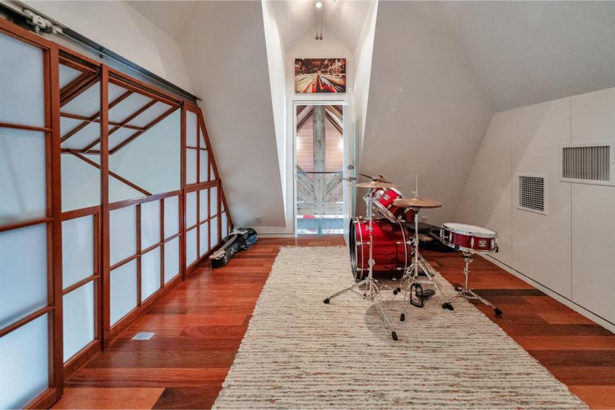 Notice the Beautiful Sliding Doors and Drum Set in This Unique Loft Space