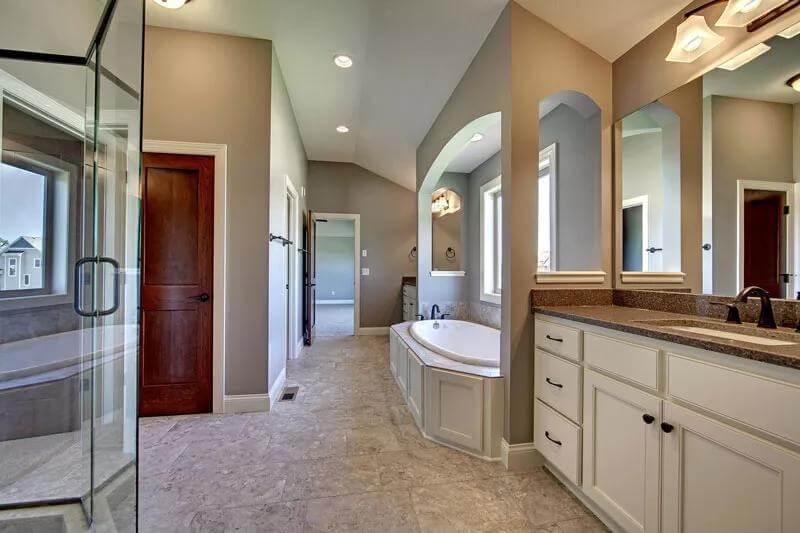 Spacious Craftsman Bathroom with a Curved Tub Nook