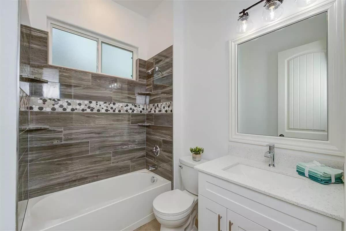 Notice the Unique Tile Mosaic in This Sleek Bathroom Design