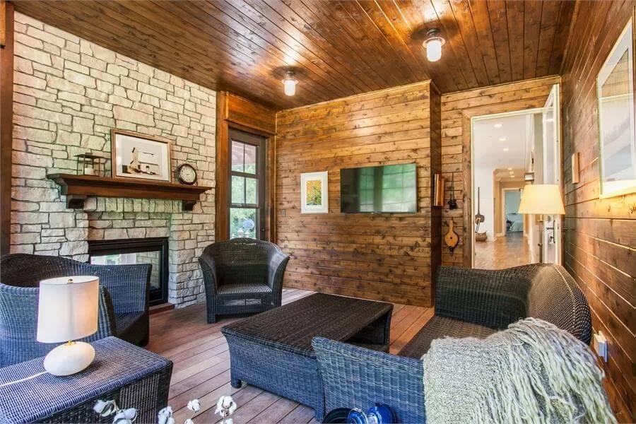 Notice the Rustic Charm of This Wood and Stone Sunroom