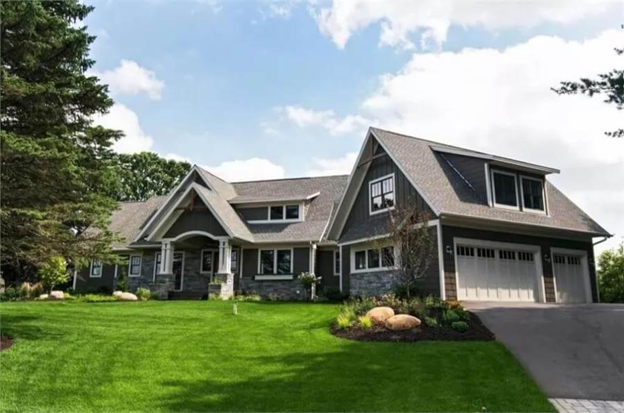 Craftsman Home with Striking Gable Roofs and Stone Accents