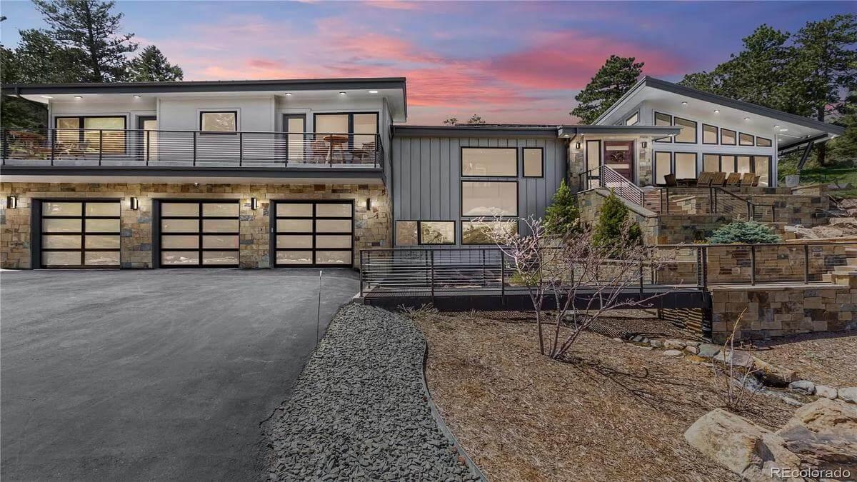 Sleek Mountain Retreat Featuring Expansive Garage Doors