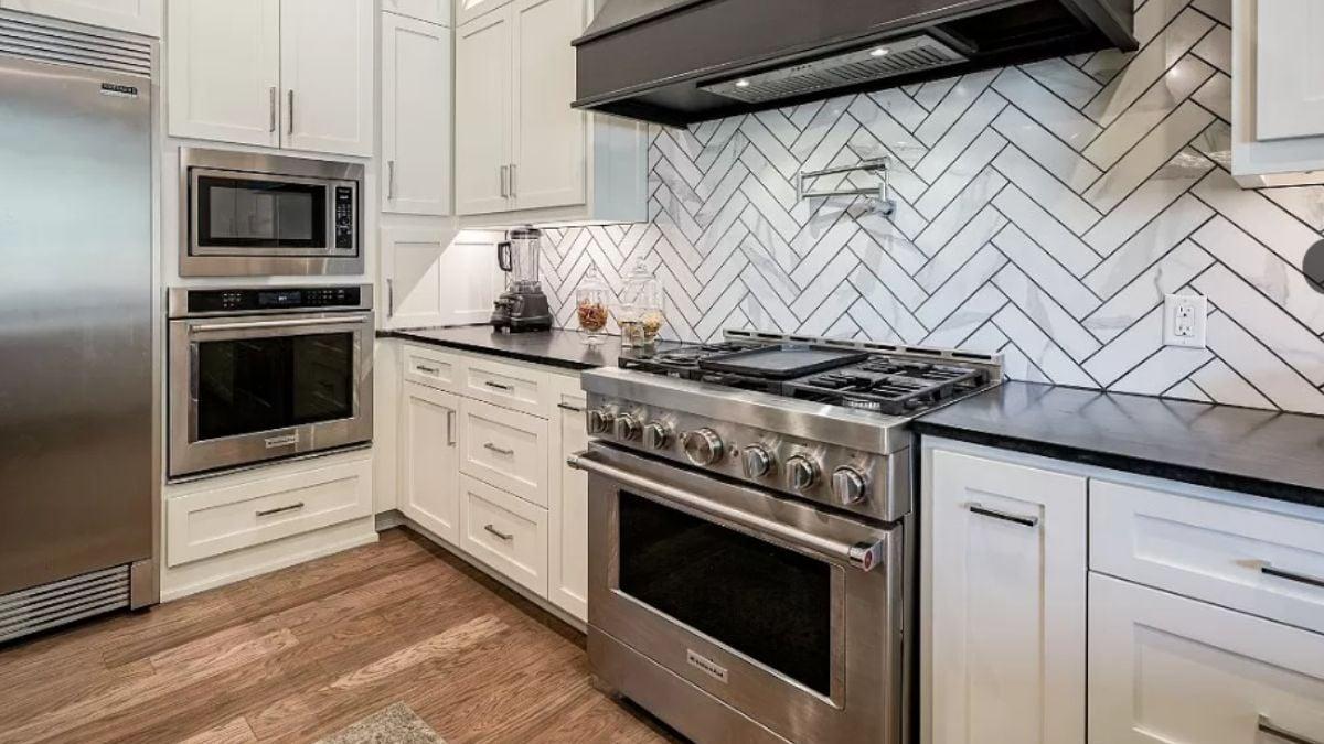 Check Out the Herringbone Backsplash in This Sleek Kitchen