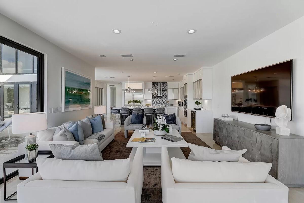 Luxurious Open-Concept Living Room Leading to a Designer Kitchen