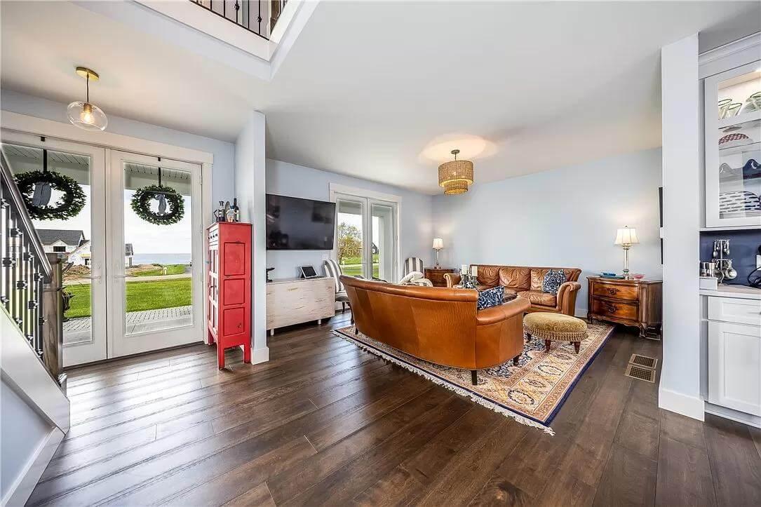 Notice the Bold Red Cabinet Adding a Pop of Color in This Cozy Living Area