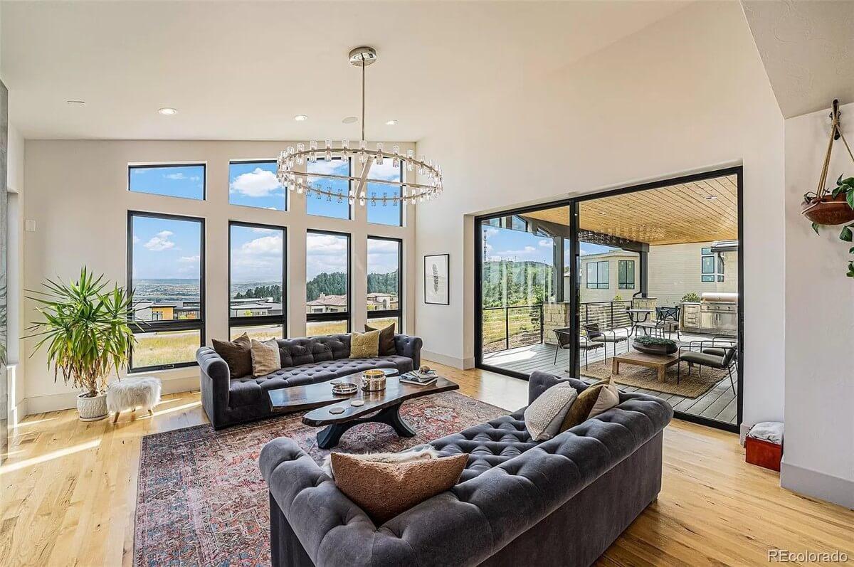 Look at That Stunning Chandelier in This Sunlit Living Room