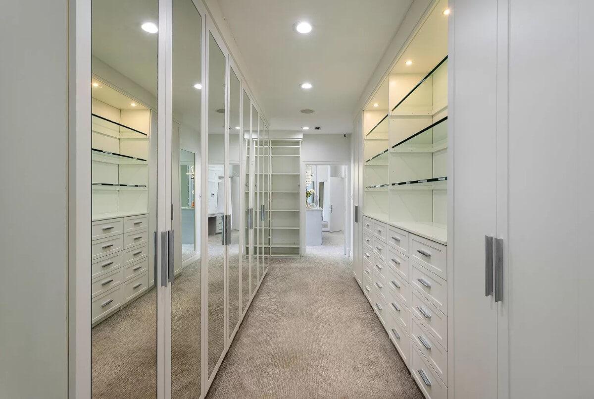 Sleek Walk-In Closet With Mirrored Doors for a Luxurious Feel