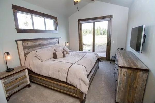 Rustic Bedroom with Reclaimed Wood Accents and Nature Views