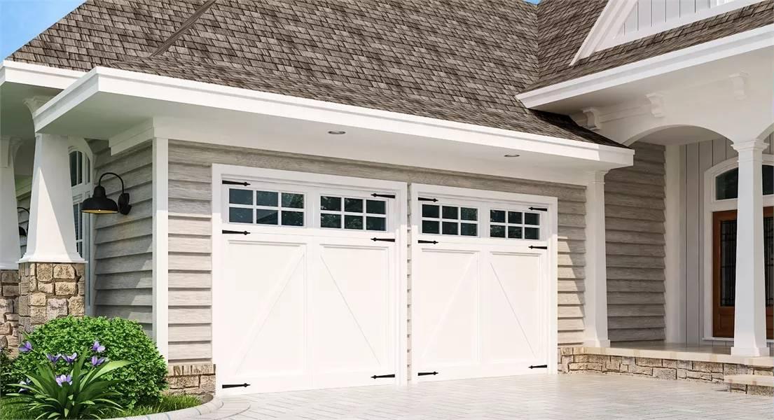 Craftsman Garage with Carriage-Style Doors and Stone Accents